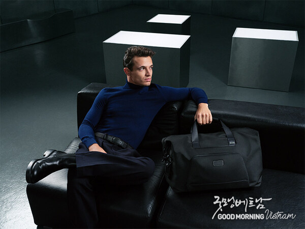 Lando Norris pictured with the Alpha Double Expansion Duffel in Black.